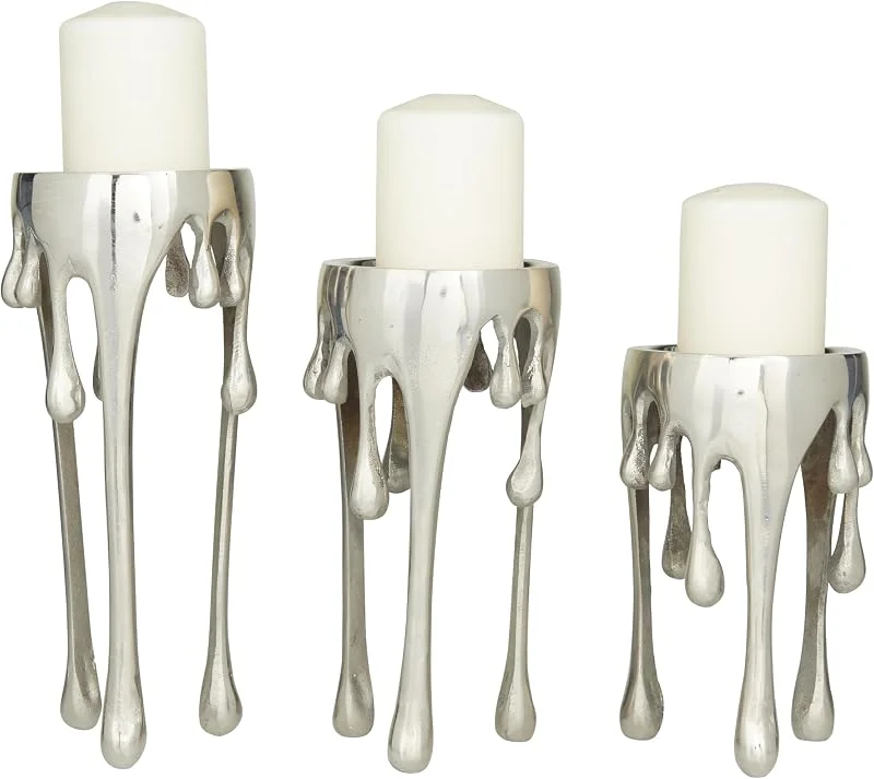 Marke: CosmoLiving by Cosmopolitan Deco 79 Abstrakte Stumpenkerzenhalter aus Aluminium mit schmelzenden Beinen, 30, 5 cm, 25, 4 cm, 20, 3 cm hoch, silberfarben, 3 Stück — Kerzenlicht Abendessen